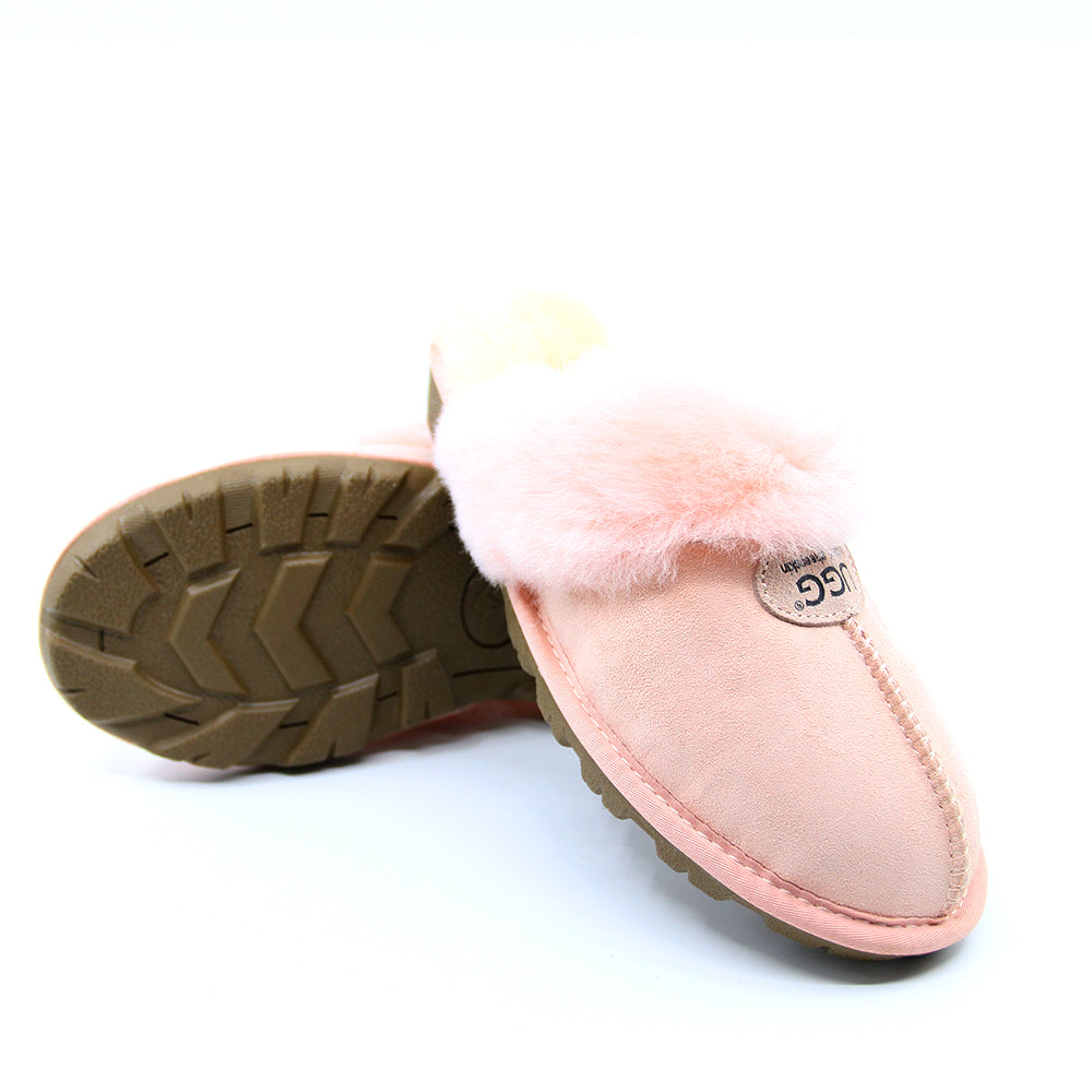 A pair of pink UGG Scuff slippers for women, featuring soft, cosy material and slip-on design perfect for indoor comfort.