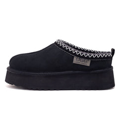Black Mackenzie Platform UGG slippers by Auzland featuring plush lining and thick platform sole, comfortable indoor footwear.