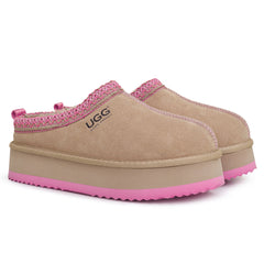 Auzland Mackenzie platform UGG slippers with plush lining and thick sole, shown on a white background.