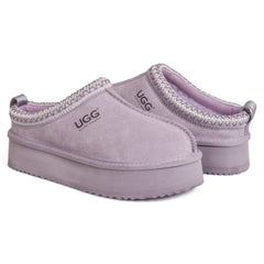 Auzland Mackenzie Platform UGG slippers featuring soft, plush material and a sturdy platform sole for comfortable indoor wear.