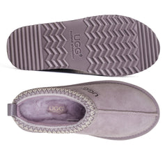 Auzland Mackenzie platform UGG slippers with soft plush lining and chunky sole, displayed on a white background.