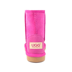 Auzland pink UGG Kids short classic boots with cosy sheepskin lining and soft suede exterior for young children.