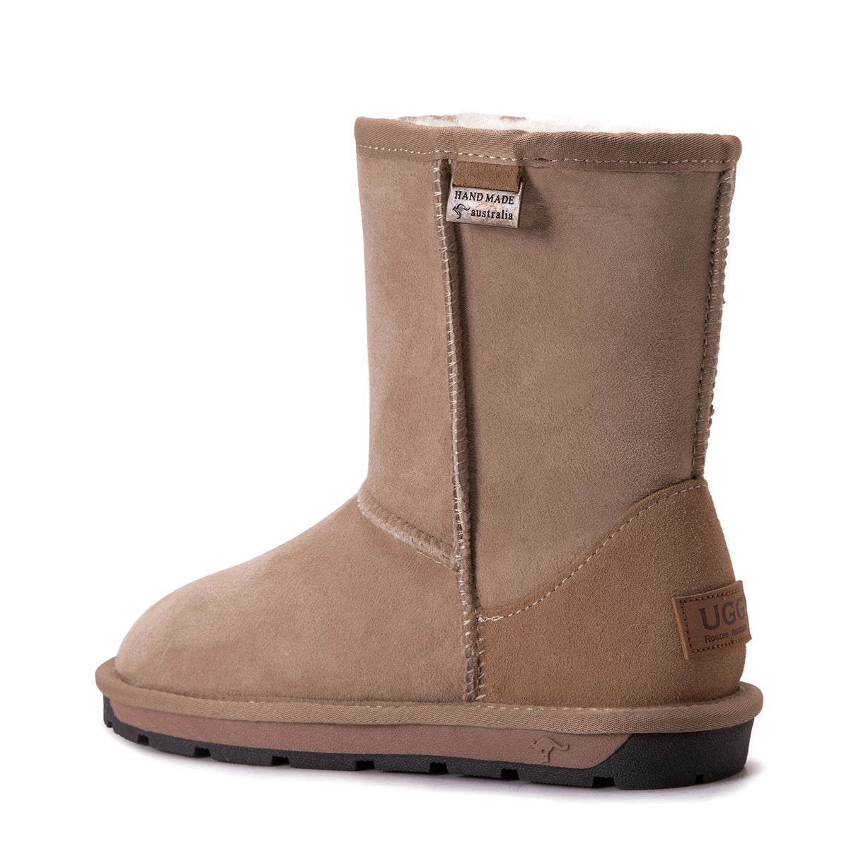 A pair of Auzland Premium Short Classic Australian Made UGG Boots for women in sand color, showing soft sheepskin lining and suede exterior.