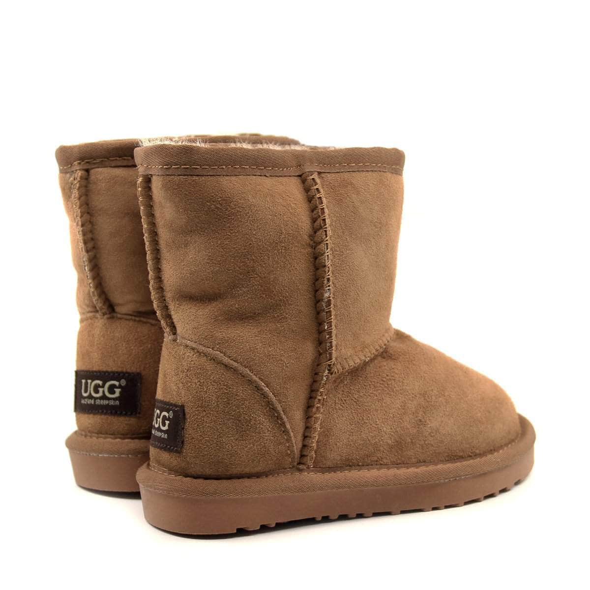 Auzland UGG Kids Short Classic Boots in cosy sheepskin with a soft suede exterior and rubber sole, designed for children.
