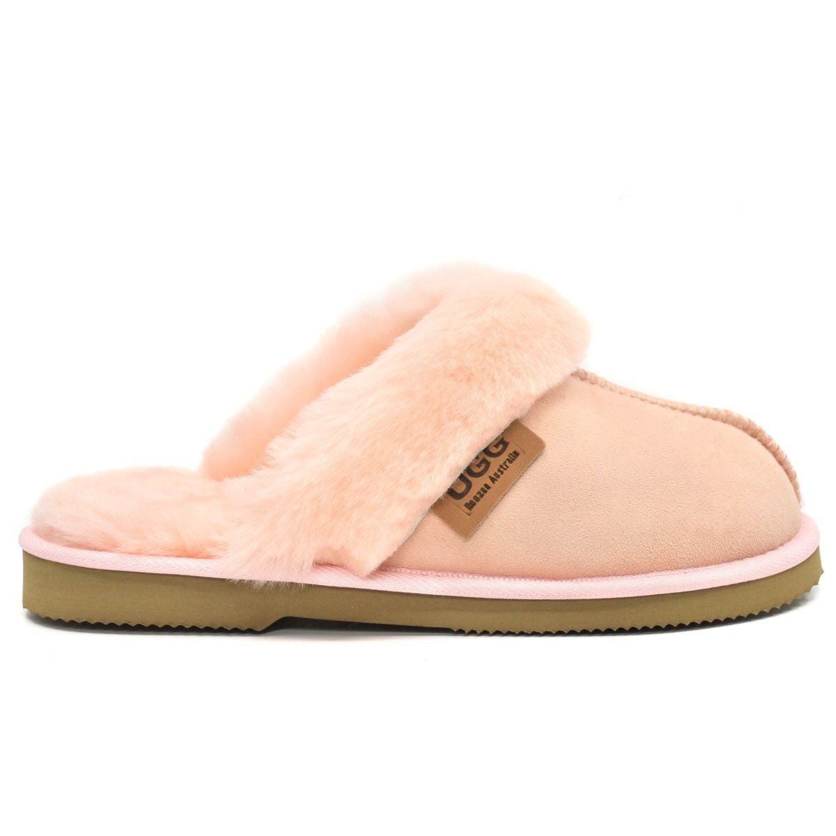 Light pink UGG premium women's slippers by Auzland, with soft plush interior and slip-on design for cosy comfort.