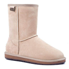 A pair of Auzland premium short classic UGG boots for women in sand color, showcasing cosy sheepskin lining and stylish design.