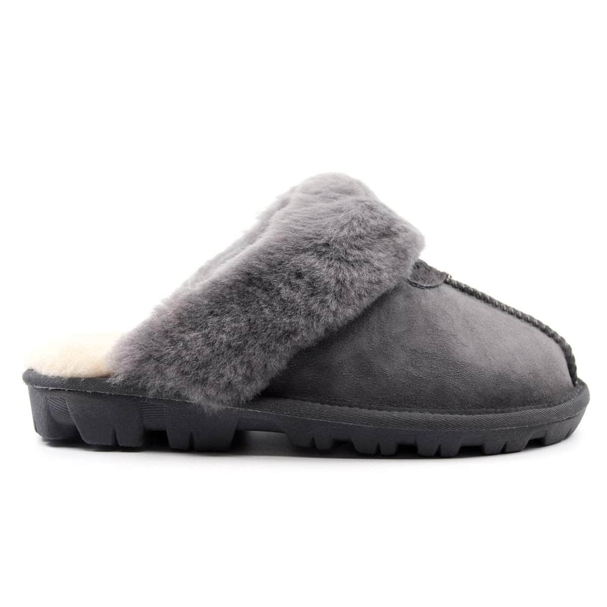 A pair of grey UGG Scuff Slippers for women and men, featuring soft plush material and slip-on design from Auzland.