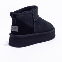 Black Auzland Ultra Mini Platform UGG Boots with a sleek design and cosy fur lining, perfect for stylish winter wear.